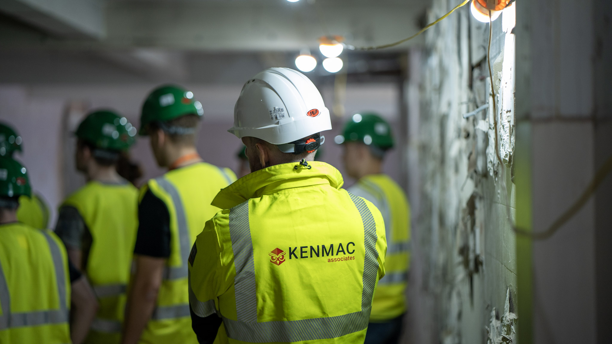 A Kenmac consultant accompanying a team through a construction site